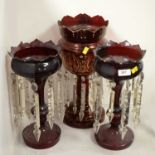 A single and a pair of Victorian cranberry glass lustres.