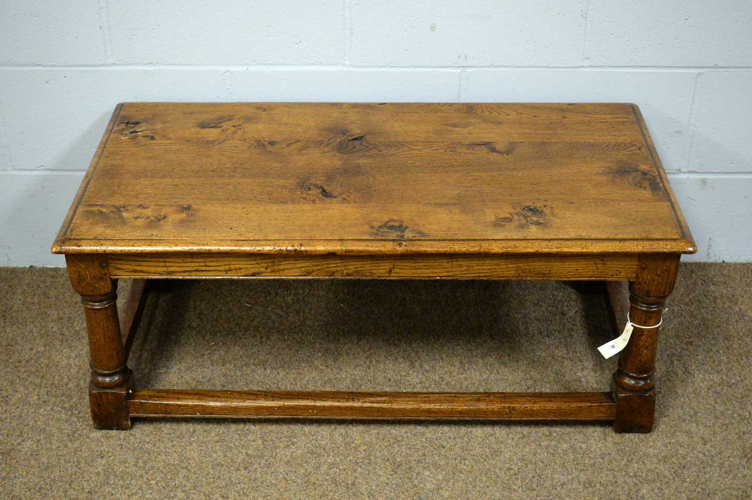 A substantial oak rectangular coffee table.