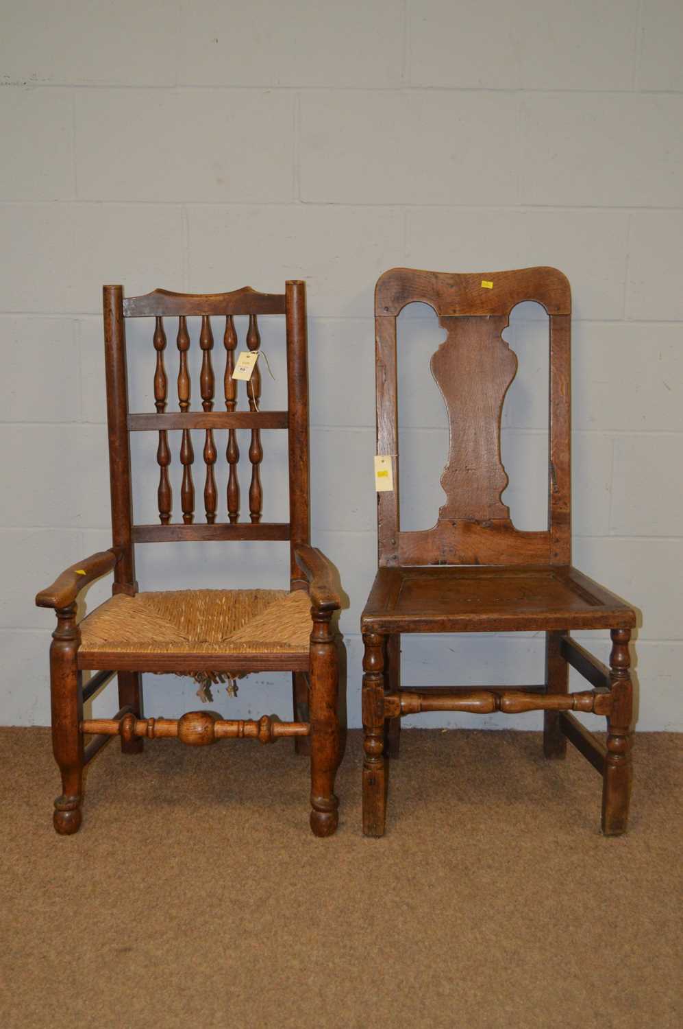 An oak rush seated occasional armchair, and another.