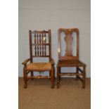 An oak rush seated occasional armchair, and another.