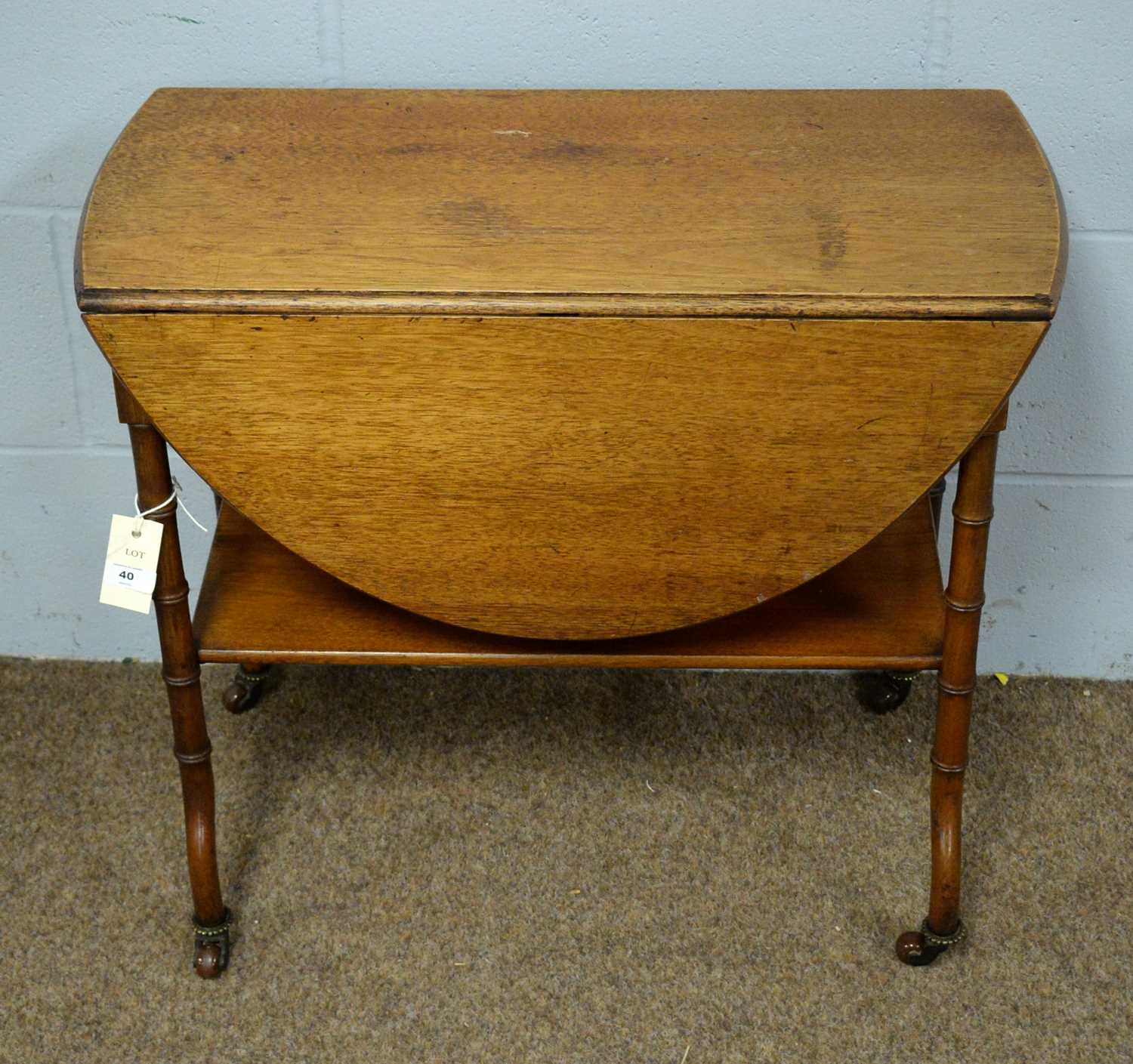 An unusual Victorian mahogany drop leaf drinks table.