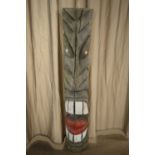 A carved North American style Totem pole