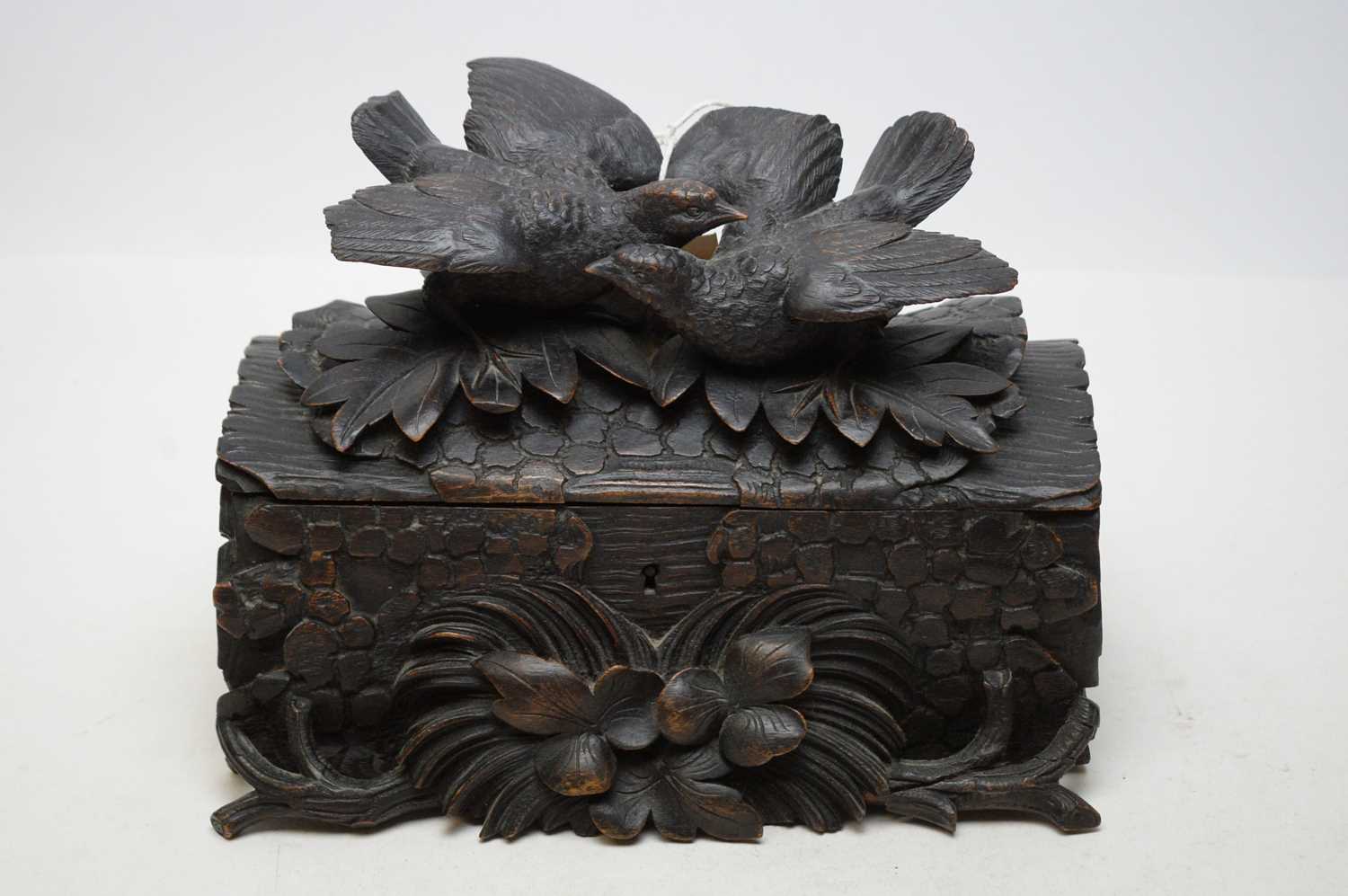 A carved Black Forest trinket box.