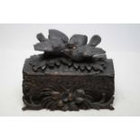 A carved Black Forest trinket box.