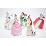 A selection of Royal Doulton ceramic lady figures.