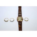 Three 9ct yellow gold rings, and a watch