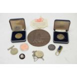 A WWI commemorative plaque, medals and medallions.