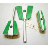 A white and green guilloche enamel three-piece dressing table set.