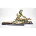 An Art Deco style silvered spelter figure of a lady.