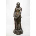 A bronzed spelter figure of a lady.