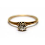 A solitaire diamond ring,