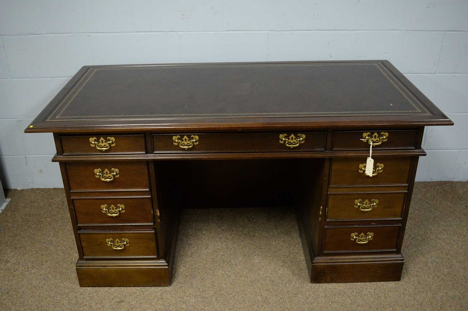 Sligh of Michigan: a reproduction Victorian style mahogany kneehole pedestal writing desk