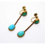 A pair of turquoise cabochon set drop earrings
