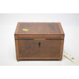 A Victorian walnut and banded tea caddy.
