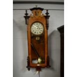A Viennese style walnut veneered wall clock