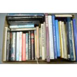 A collection of hardback coffee table and other books.