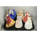 A collection of six Royal Doulton ceramic figures of ladies.