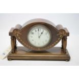 An Edwardian mahogany miniature mantel clock.