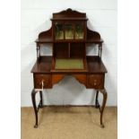 An Edwardian mahogany lady’s writing desk.