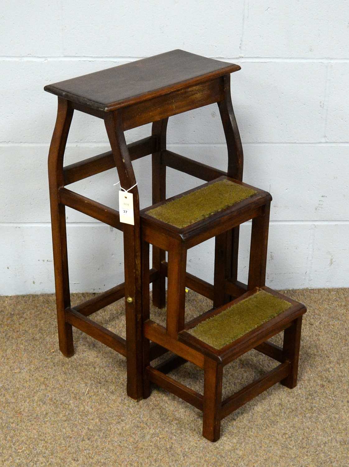 A set of mahogany folding library steps.