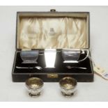 An Art Deco silver condiment set together with two silver table salts