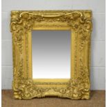 An ornate late 19th Century giltwood mirror.