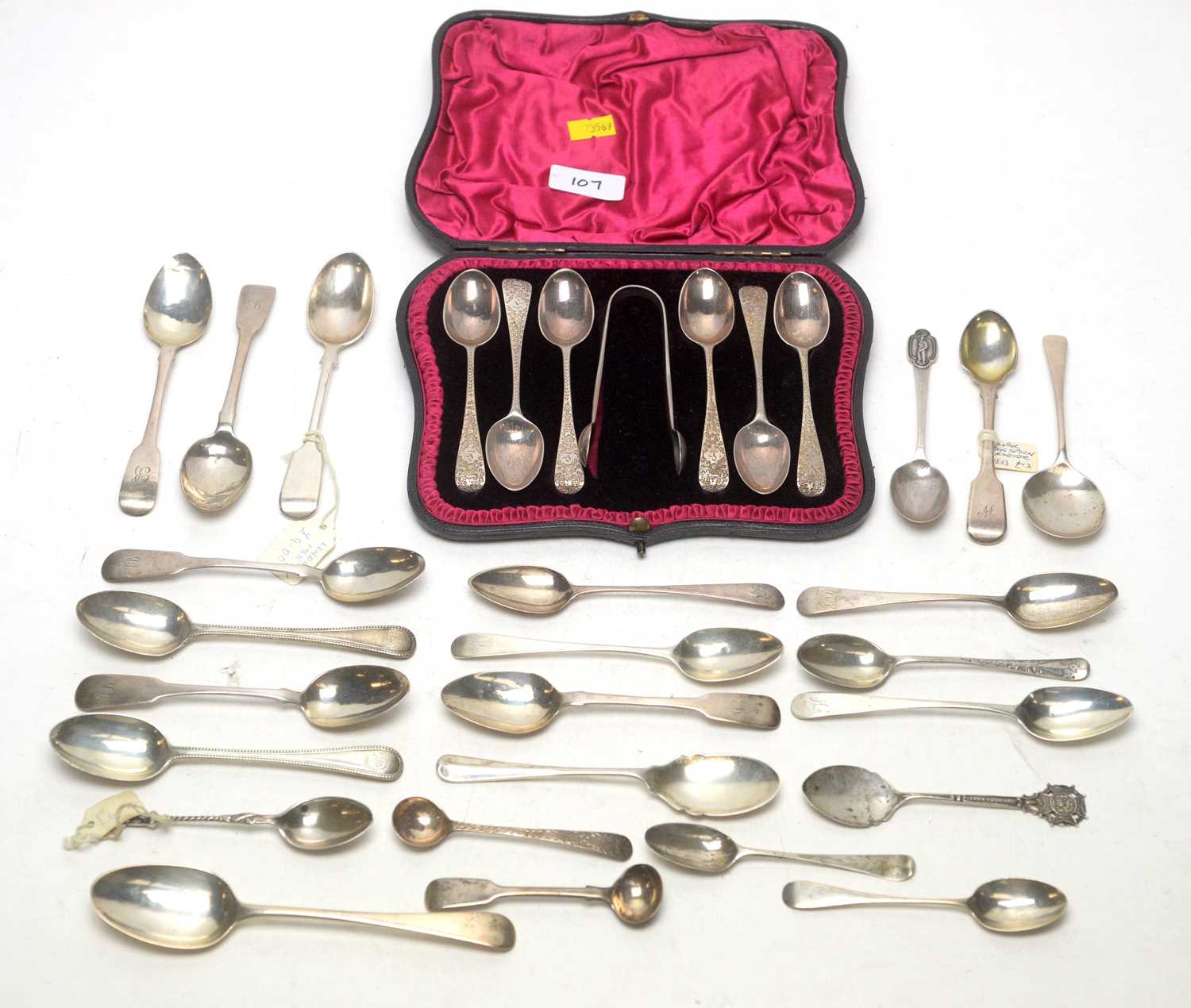 A cased silver set of six teaspoons and tongs; and other spoons