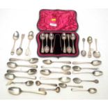 A cased silver set of six teaspoons and tongs; and other spoons