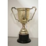 A silver plated twin-handled trophy cup.