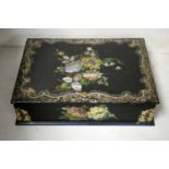 A Victorian inlaid and enamel decorated lacquered writing box.