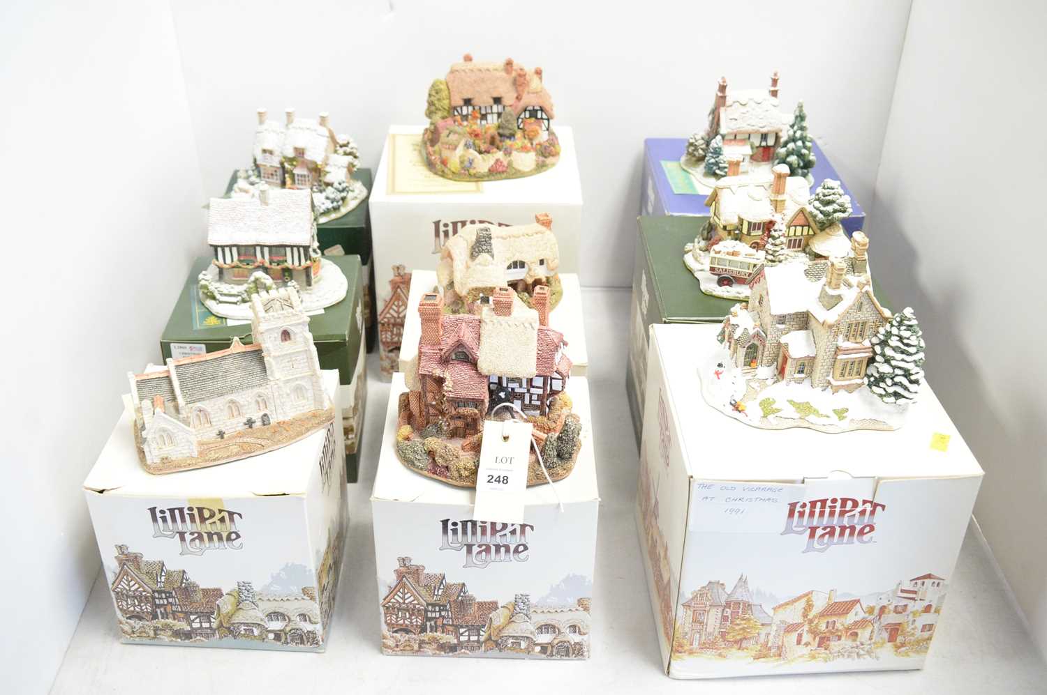 A collection of Lilliput Lane collectible architectural sculptures.