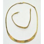 A 14ct three-coloured gold necklace and bracelet,