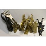 A selection of brass and cast metal door stops.