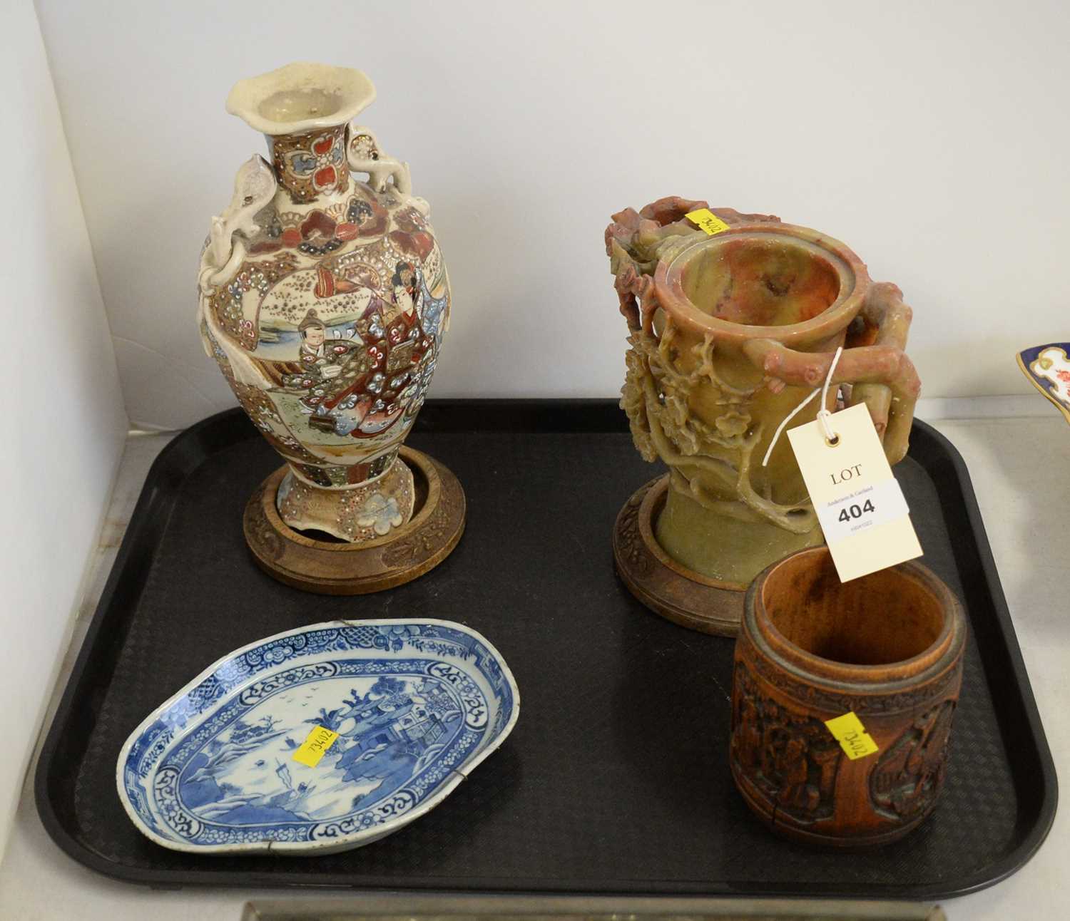 A selection of Oriental wares; and two wood stands.