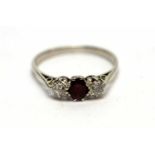 A diamond and ruby three-stone ring,