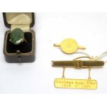 Two Chinese gold tie pins and a ring