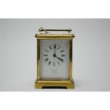 A French brass-cased carriage clock.