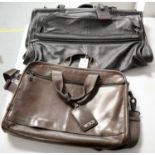 Tumi tri-fold garment carry bag; and a Tumi leather satchel.