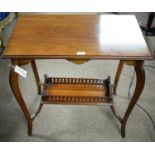 An Edwardian mahogany two-tier occasional table.