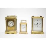 Two French gilt cased carriage clocks; and a smaller carriage clock.