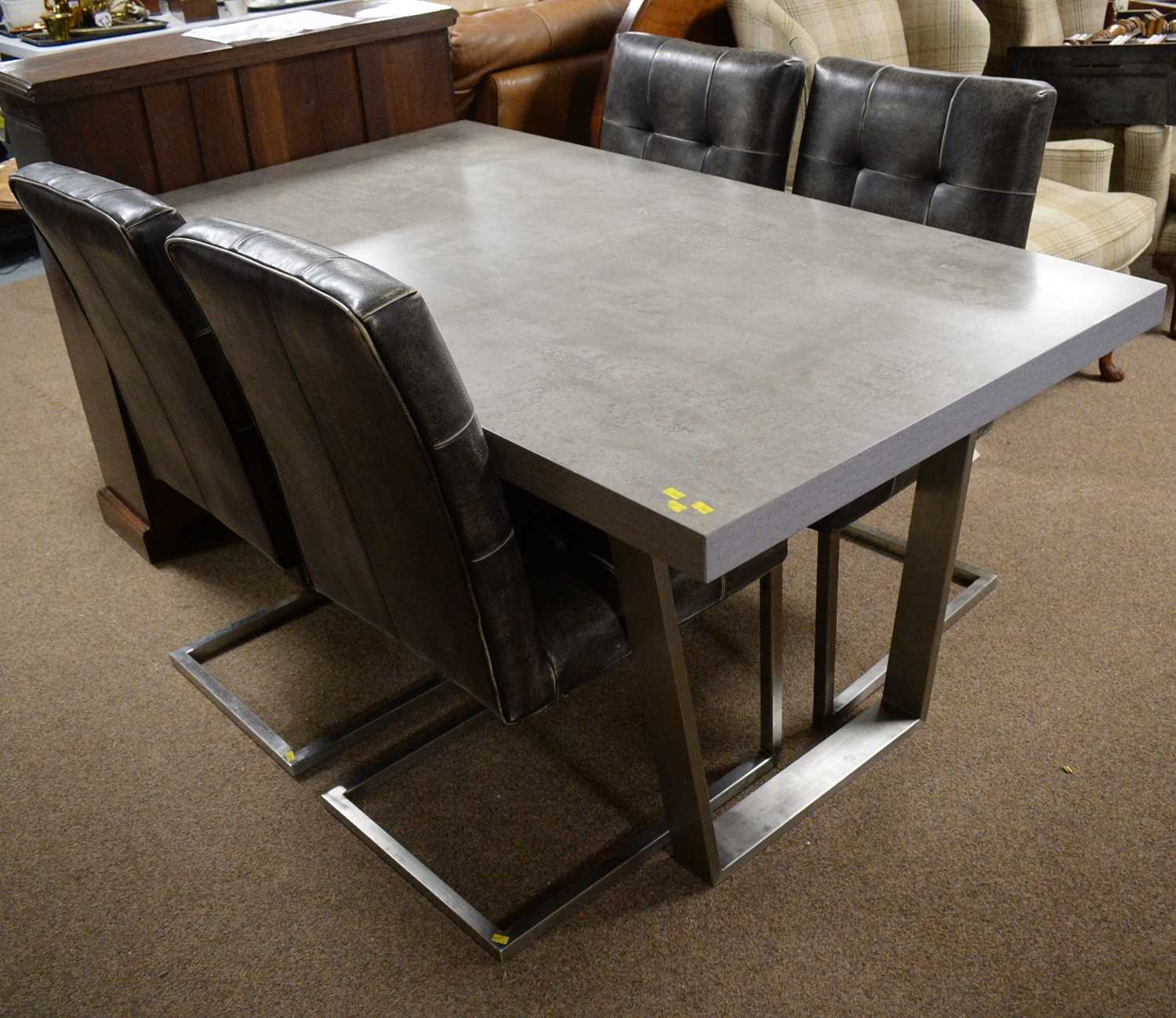 Grey marble effect dining table; and four leather-effect dining chairs.