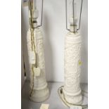 A pair of white painted table lamps.