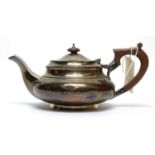 A silver teapot, by Walker & Hall,