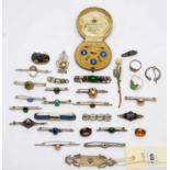 A selection of silver and other brooches, and other items