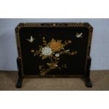 A late 20th Century Asian lacquered firescreen.