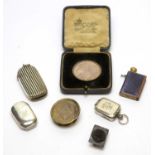 A silver vesta case; a silver medallion, and other items