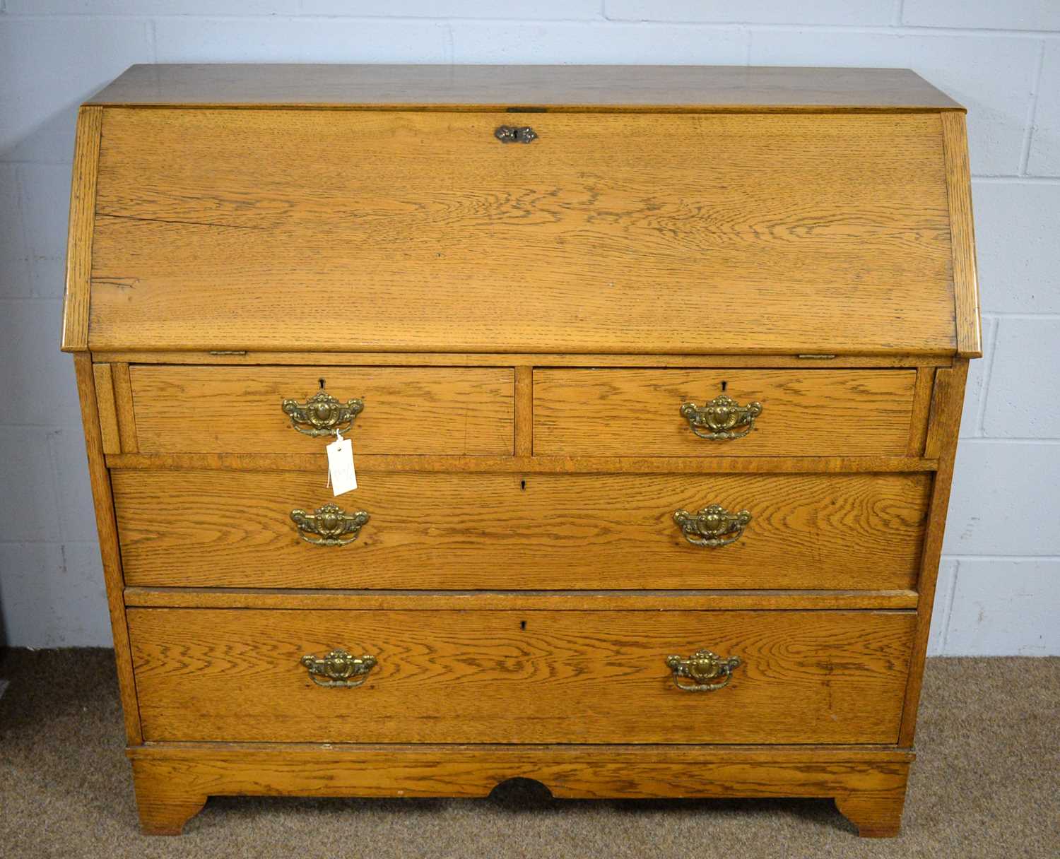 An early 20th Century oak bureau.