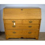 An early 20th Century oak bureau.