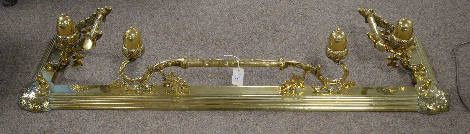 An unusual late Victorian brass fire fender.