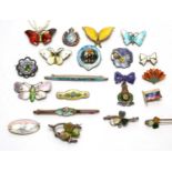 A selection of silver and enamel brooches, and others